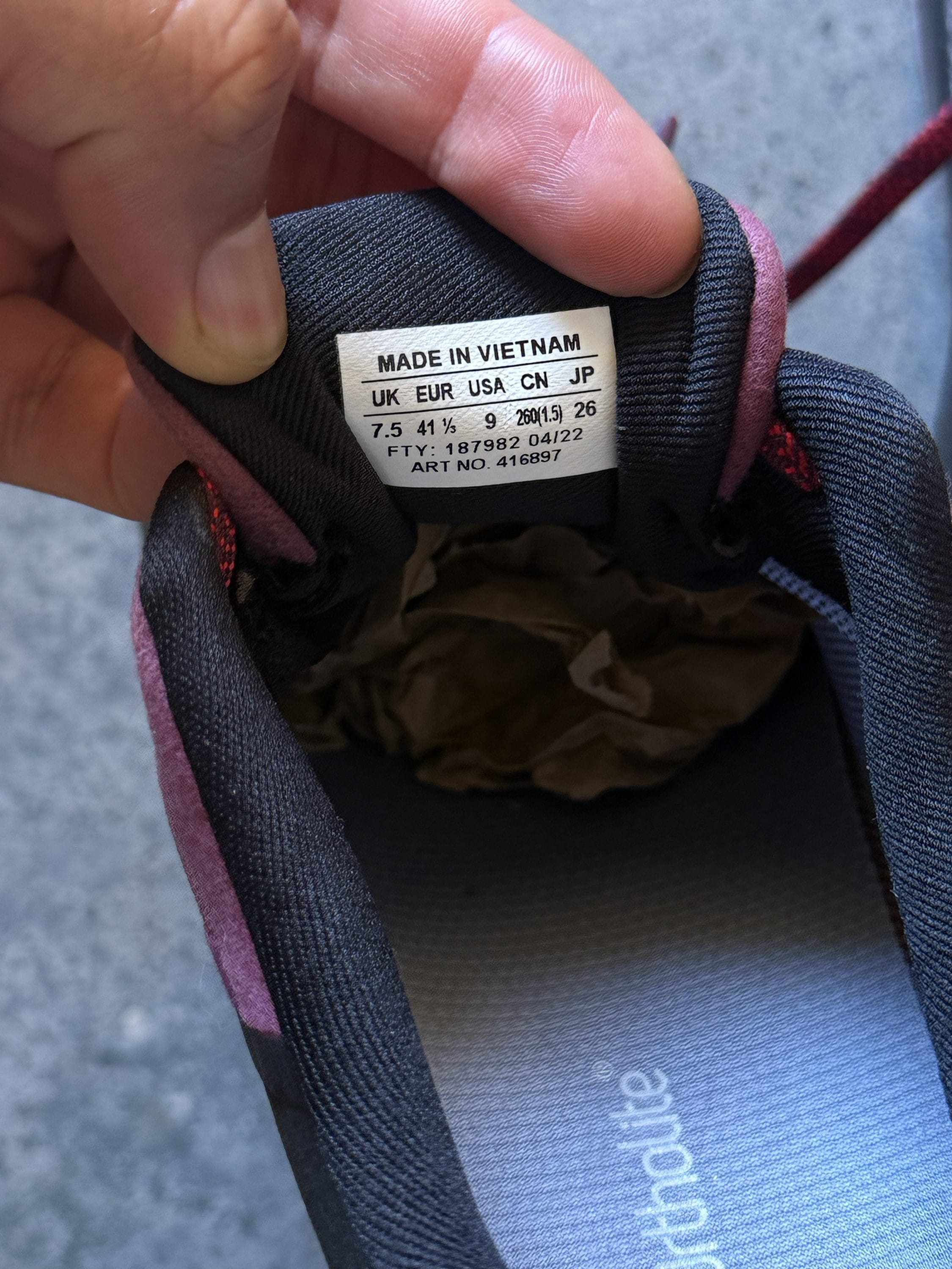 Close-up of a sneaker tongue label reading Made in Vietnam with size UK 7.5 / EUR 41 1/3 / USA 9.